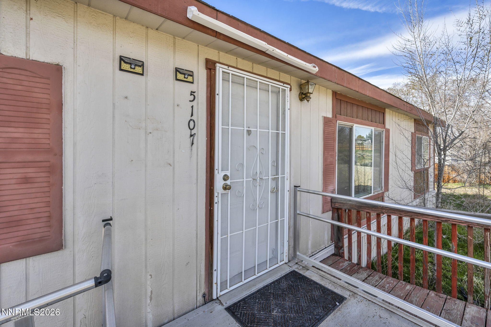 5107 Leon Drive Sun Valley, NV 89433 - Photo 3 of 43 a view of a porch with wooden floor and outdoor space
