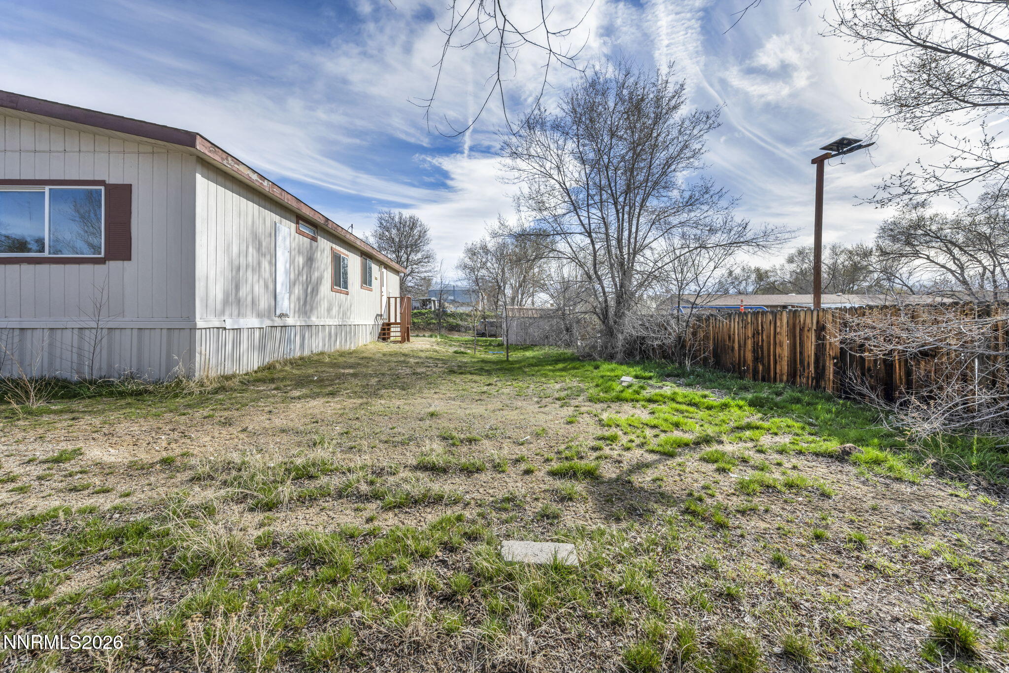 5107 Leon Drive Sun Valley, NV 89433 - Photo 33 of 43 a backyard of a house with lots of green space