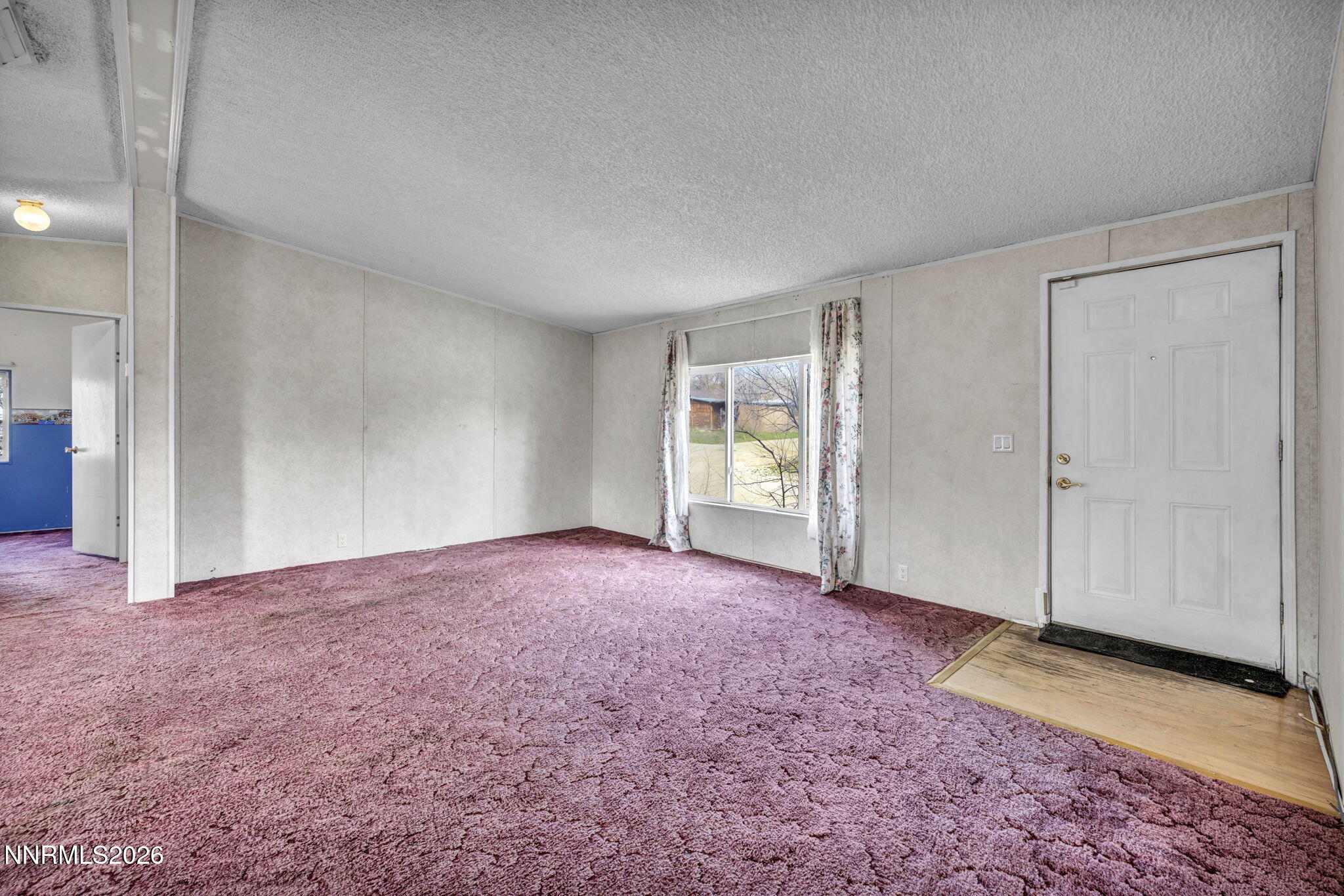 5107 Leon Drive Sun Valley, NV 89433 - Photo 10 of 43 an empty room with windows and closet