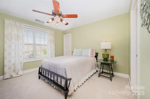 a bedroom with a bed and a table