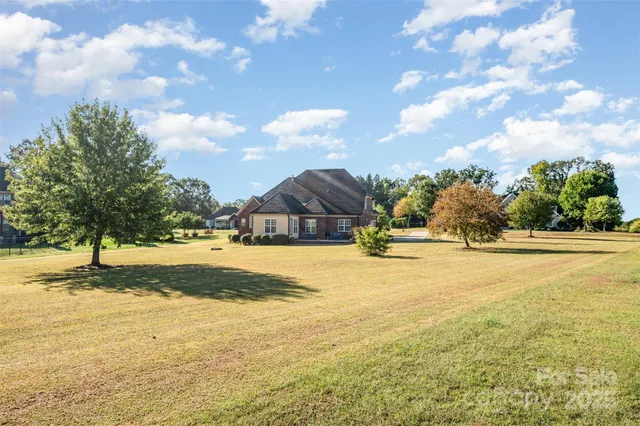 a view of a swimming pool with an outdoor space and seating area