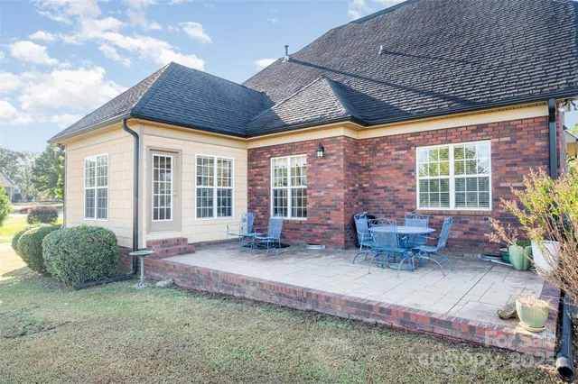 a house with potted plants in front of it