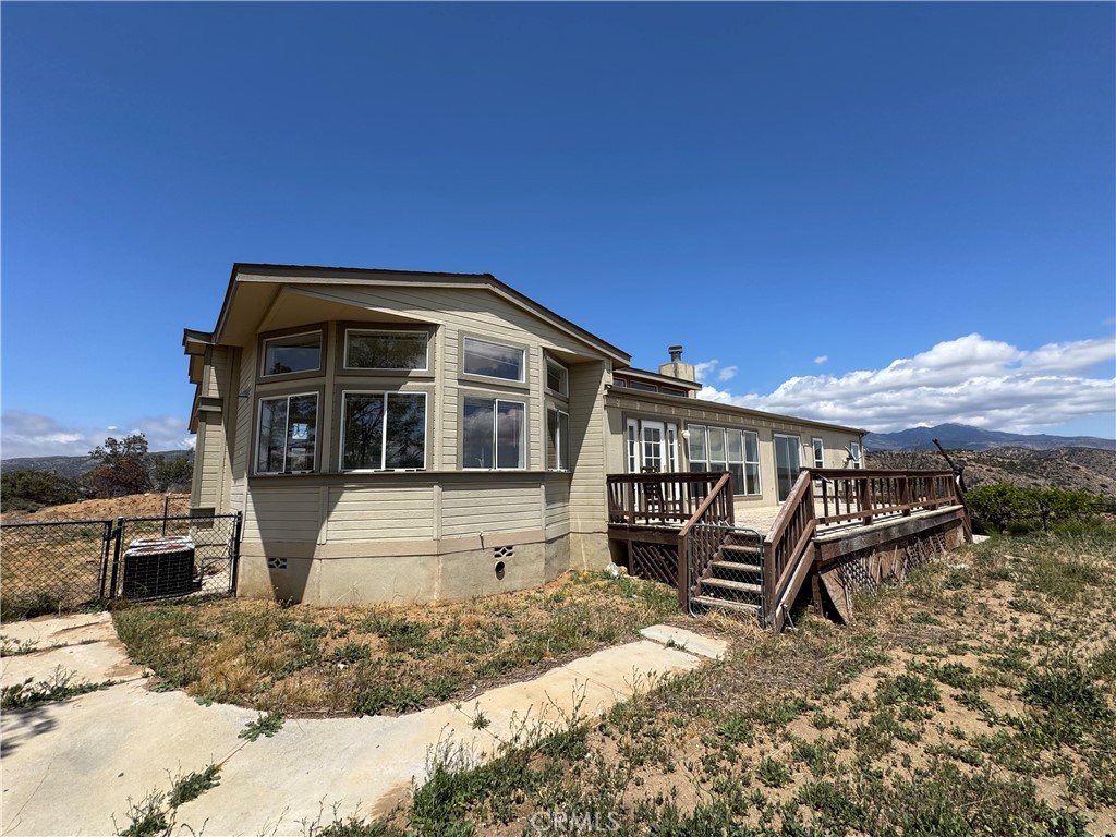 61225 High Country Trail Anza, CA 92539 - Photo 26 of 34 a front view of a house with garden