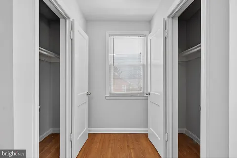 a view of front door with wooden floor