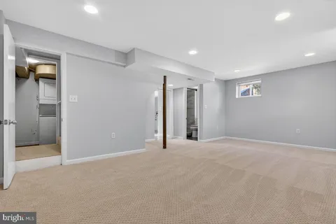 a view of an empty room with glass door