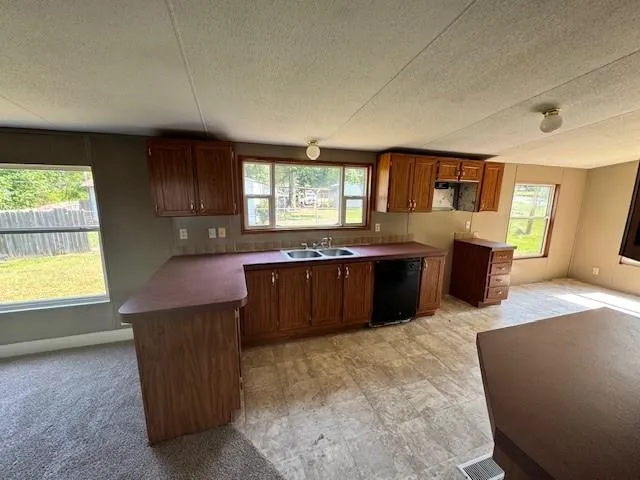 a view of a kitchen with a sink cabinets and window