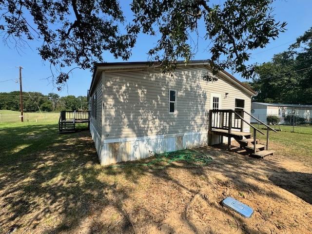 6186 Pine Tree Loop Shreveport, LA 71107 - Photo 2 of 18 a view of a house with a yard