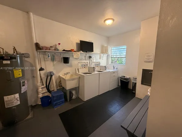 a view of living room with furniture a flat screen tv and appliances