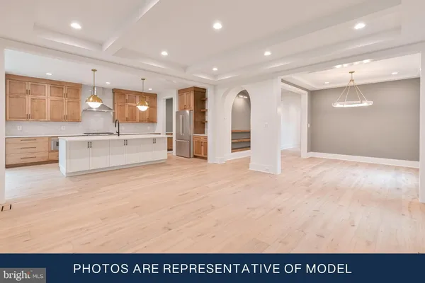 a view of kitchen with stainless steel appliances cabinets