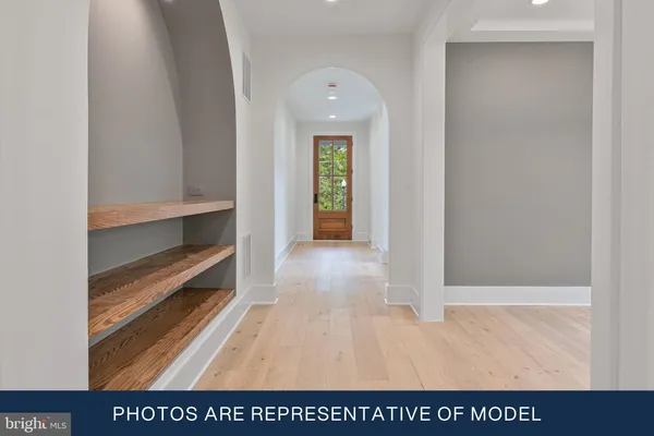 a view of entryway with wooden floor