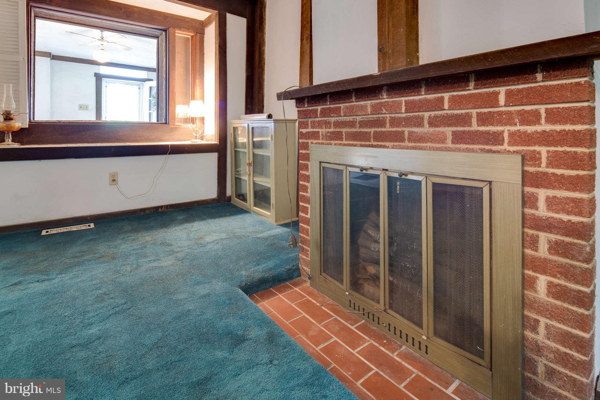 10537 Green Valley Road Union Bridge, MD 21791 - Photo 11 of 30 a view of an empty room with window and fireplace