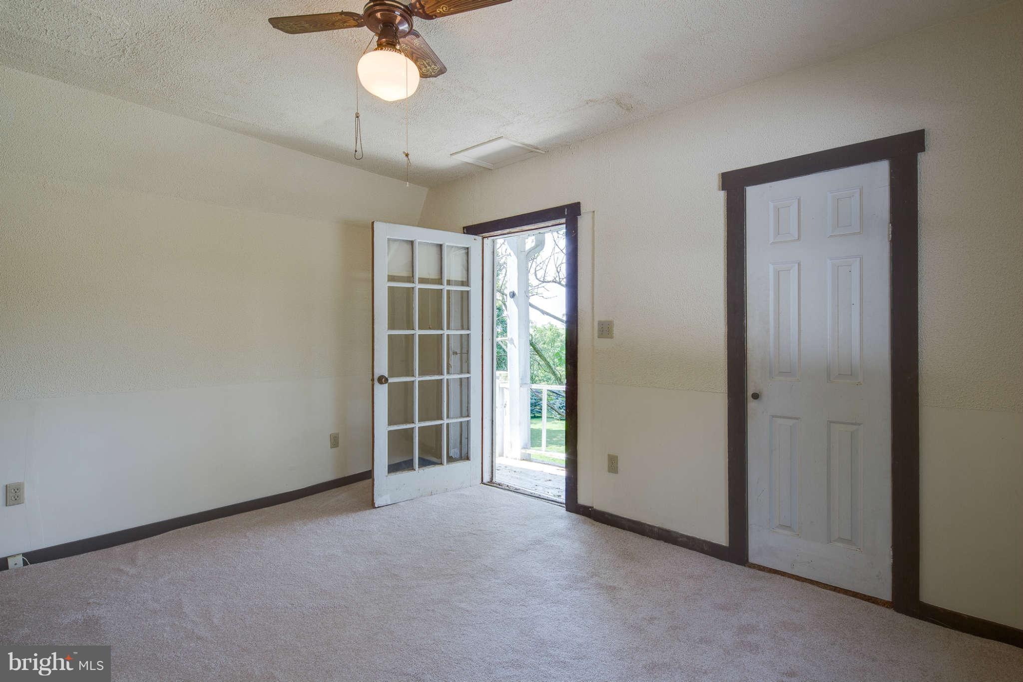 10537 Green Valley Road Union Bridge, MD 21791 - Photo 19 of 30 an empty room with closet and windows
