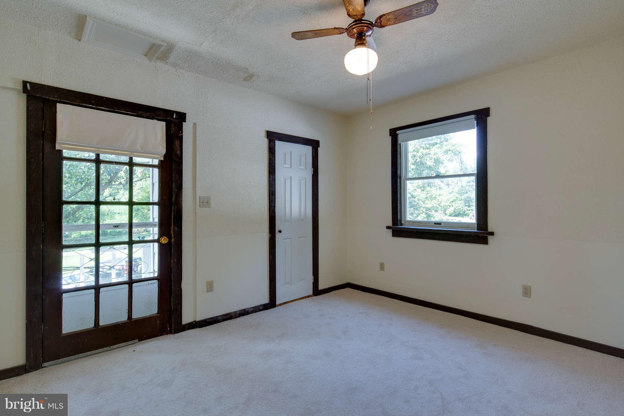 10537 Green Valley Road Union Bridge, MD 21791 - Photo 20 of 30 an empty room with windows and fan