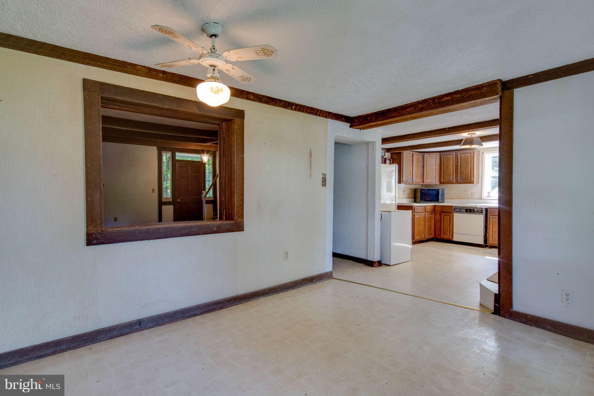 10537 Green Valley Road Union Bridge, MD 21791 - Photo 5 of 30 a view of empty room with a ceiling fan and window