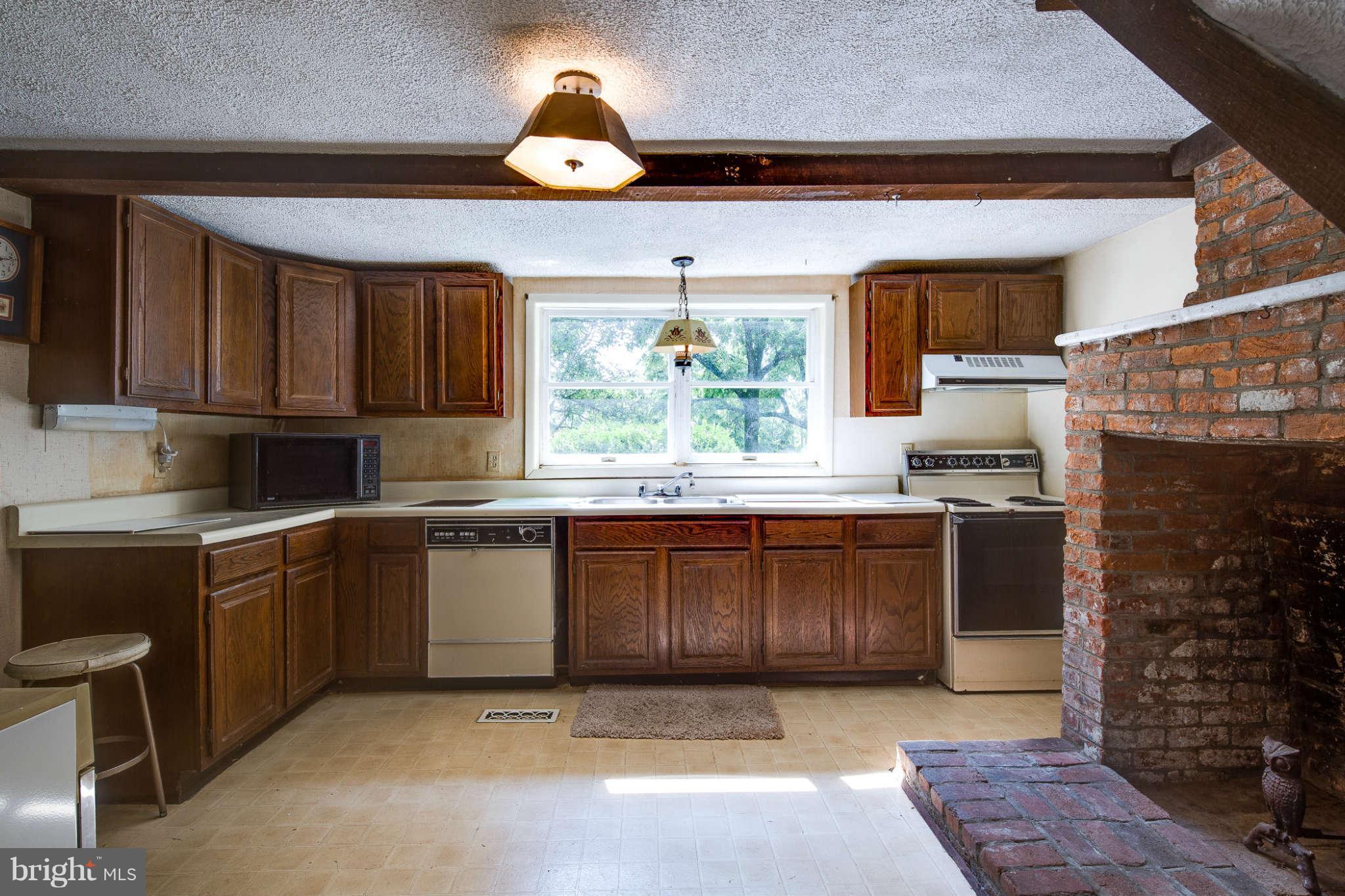 10537 Green Valley Road Union Bridge, MD 21791 - Photo 6 of 30 a kitchen with a sink cabinets and window