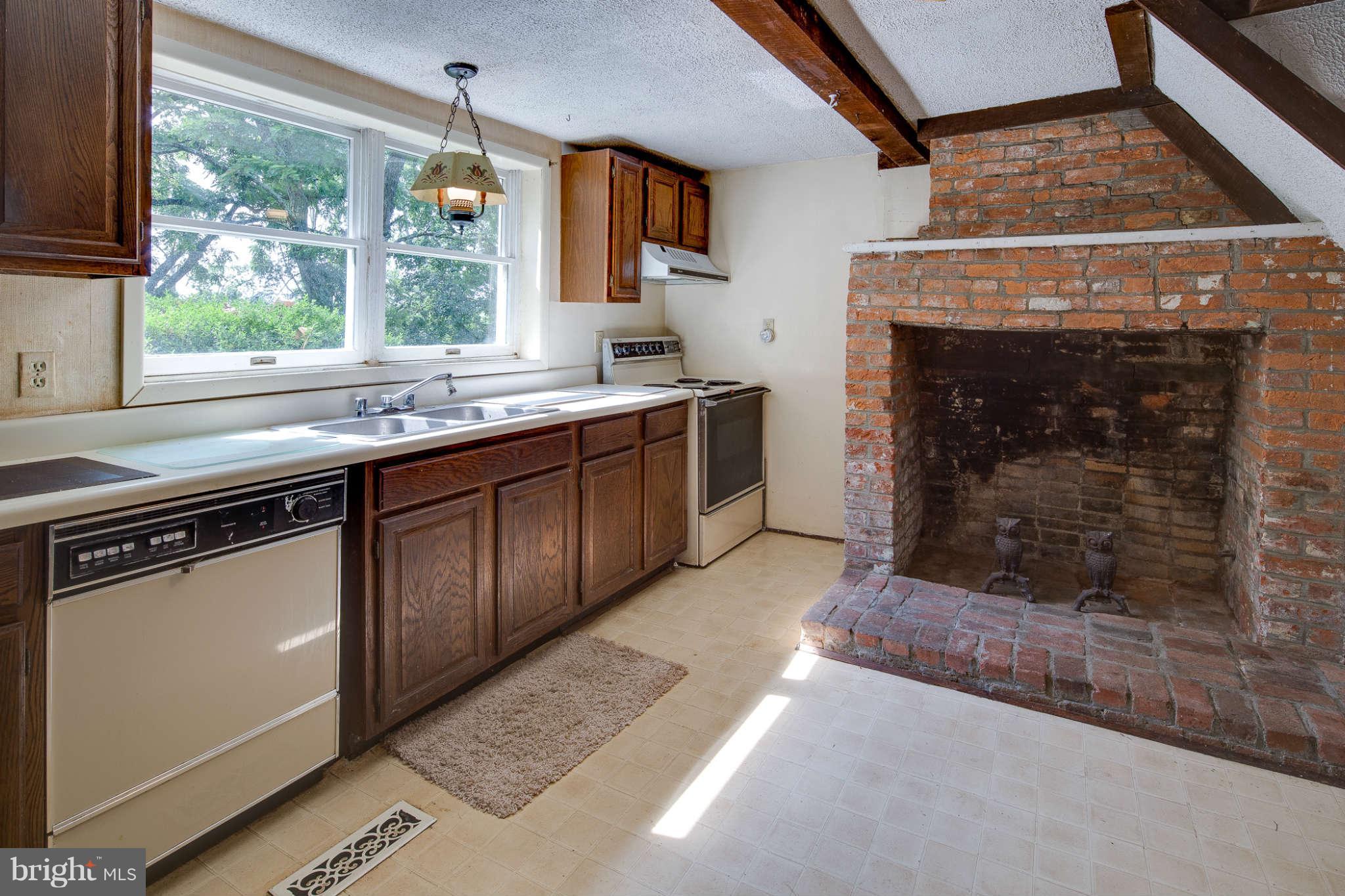 10537 Green Valley Road Union Bridge, MD 21791 - Photo 7 of 30 a kitchen with a sink stove and cabinets