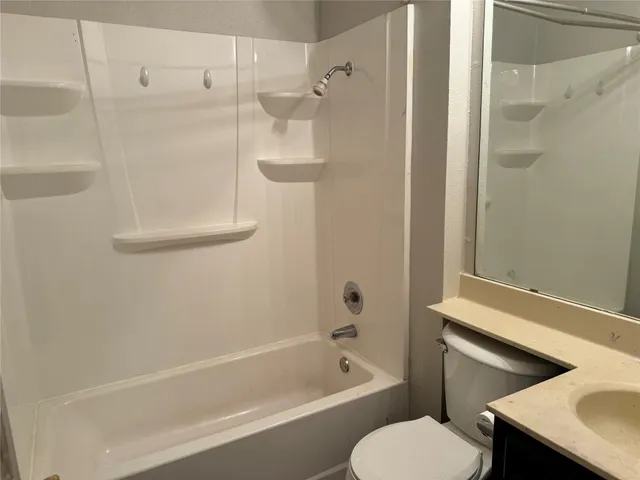 a bathroom with a tub and shower