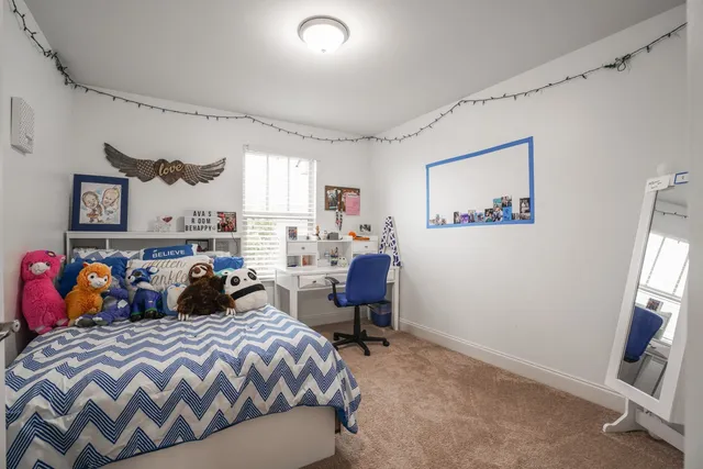 a view of a hallway to closet and utility room