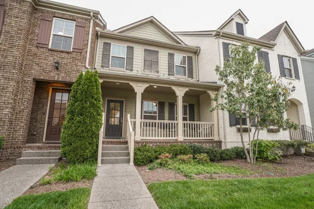 a view of living room with furniture and floor to ceiling window