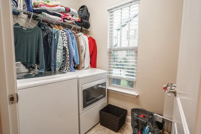 a view of a balcony with two chairs and a table