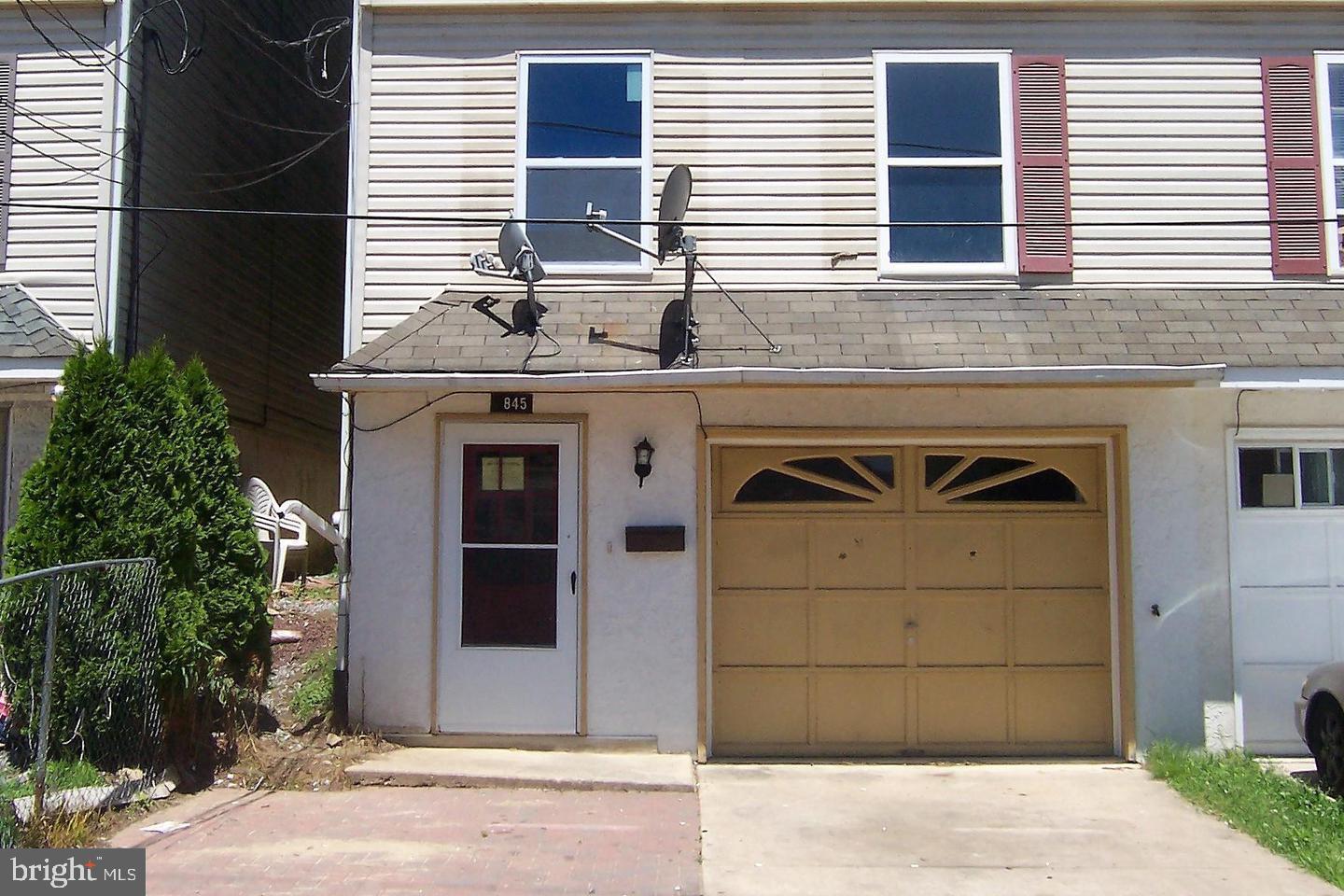 a view of a house with a door and garage