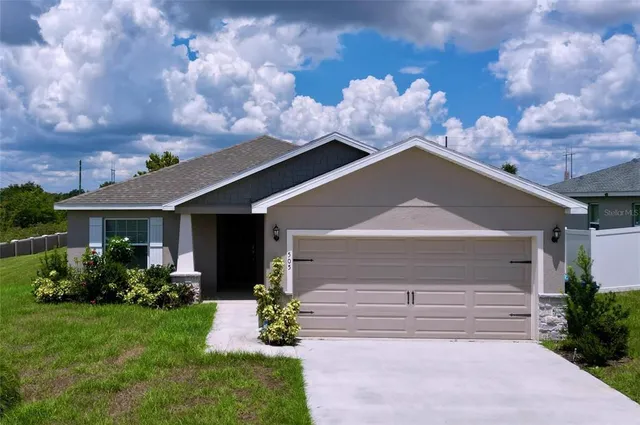 a front view of house with garden