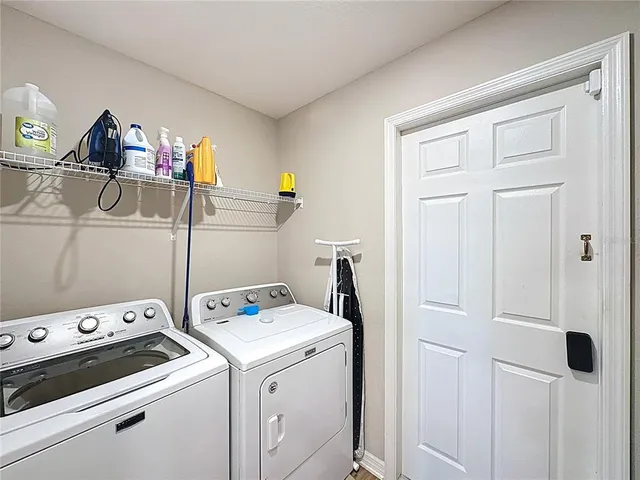 a view of a workspace with furniture