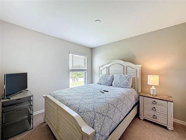 a en suite bathroom with double sink and a mirror