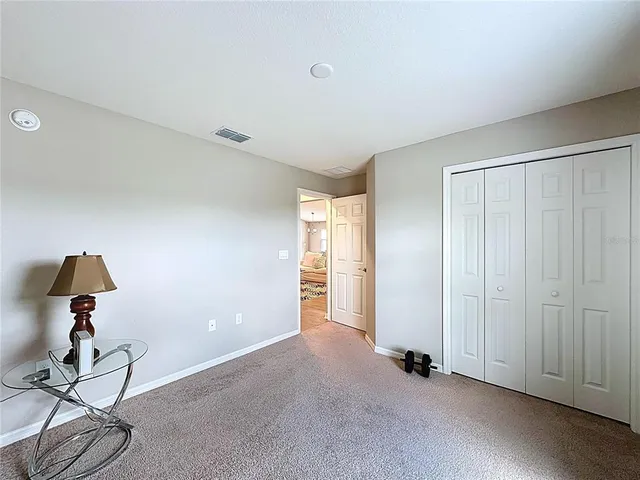 a front view of a house with a yard and a garage