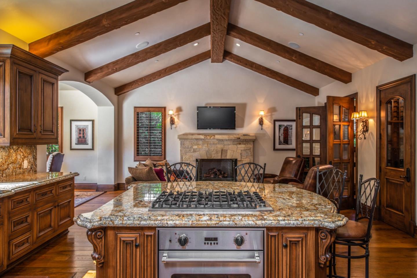 1010 Ocean Road Pebble Beach, CA 93953 - Photo 9 of 32 a large kitchen with a table and chairs