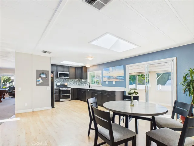 a kitchen with a table and chairs in it