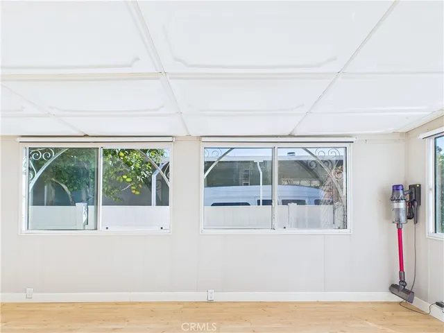 a view of a living room and a large window