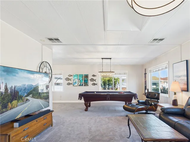 a living room with furniture and a table