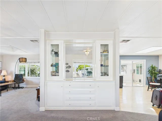 a view of living room filled with furniture and window