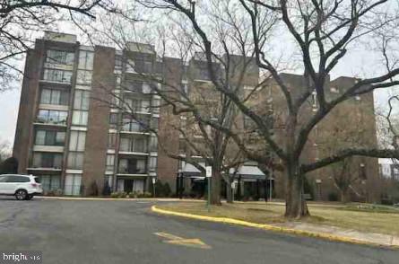 a building with trees in front of it