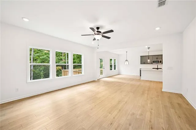 a view of a kitchen with a sink and a fireplace