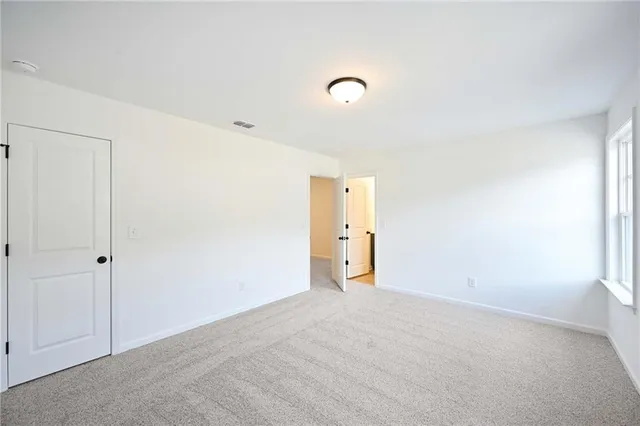 a bathroom with a toilet and a bathtub