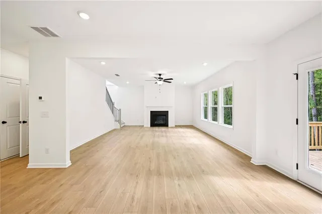 a view of a kitchen with a sink and a refrigerator