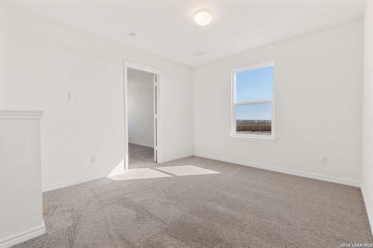 10045 Jagger Avenue Converse, TX 78109 - Photo 22 of 28 an empty room with a window