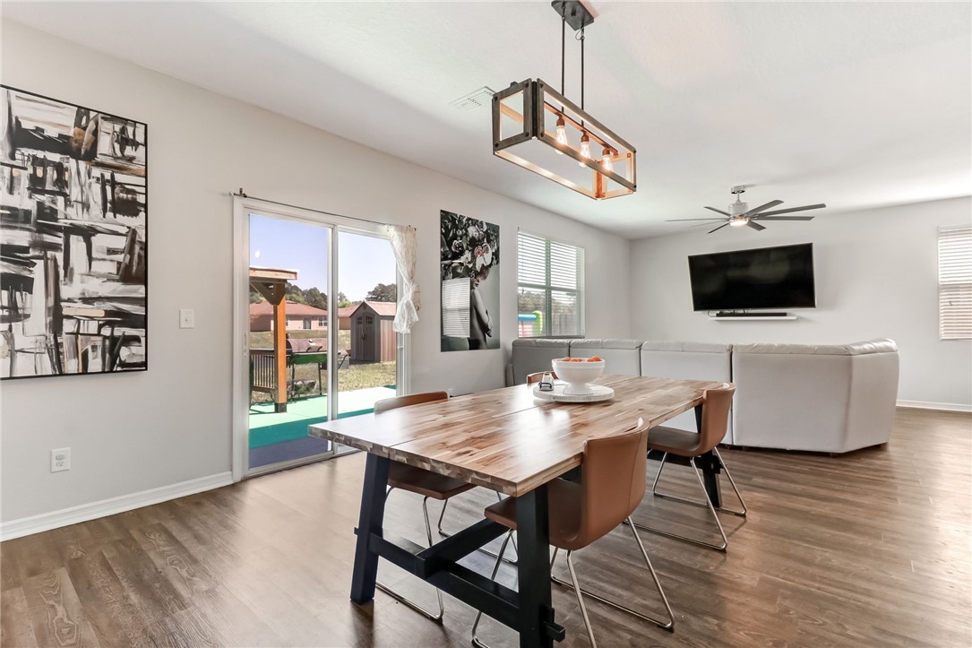 45170 Dutton Way Callahan, FL 32011 - Photo 12 of 35 a view of a dining room with furniture and wooden floor