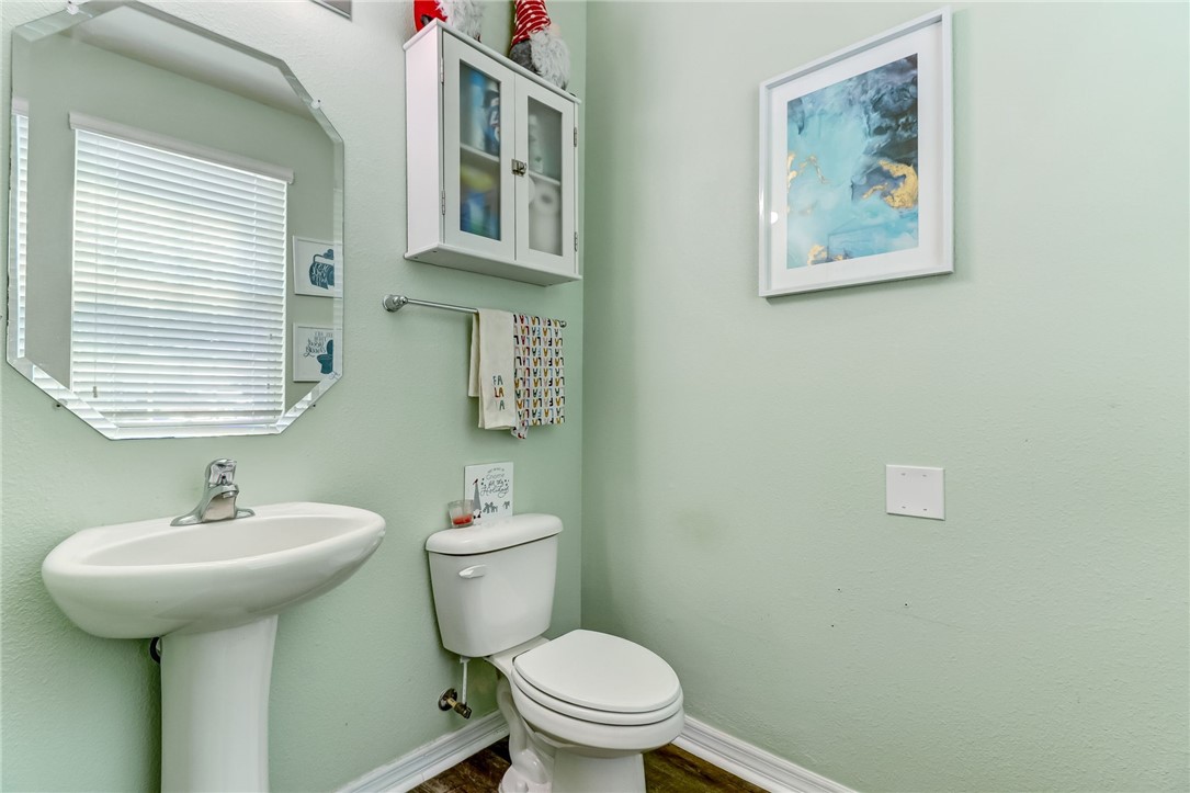 45170 Dutton Way Callahan, FL 32011 - Photo 13 of 35 a bathroom with a toilet sink and mirror