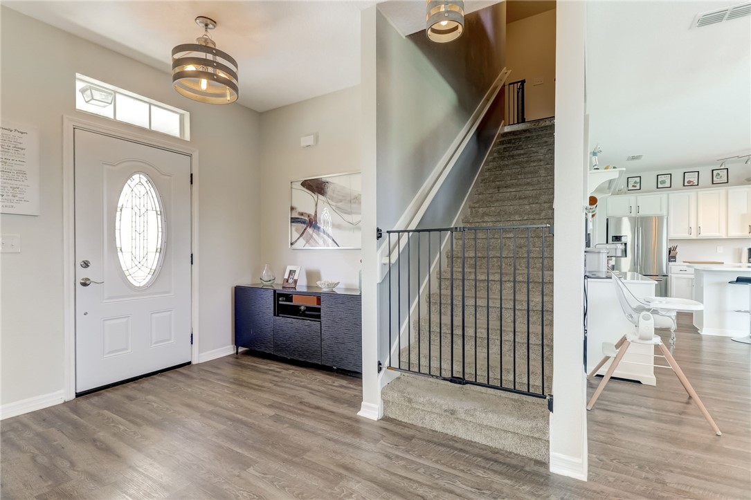 45170 Dutton Way Callahan, FL 32011 - Photo 14 of 35 a view of a hallway with wooden floor and staircase
