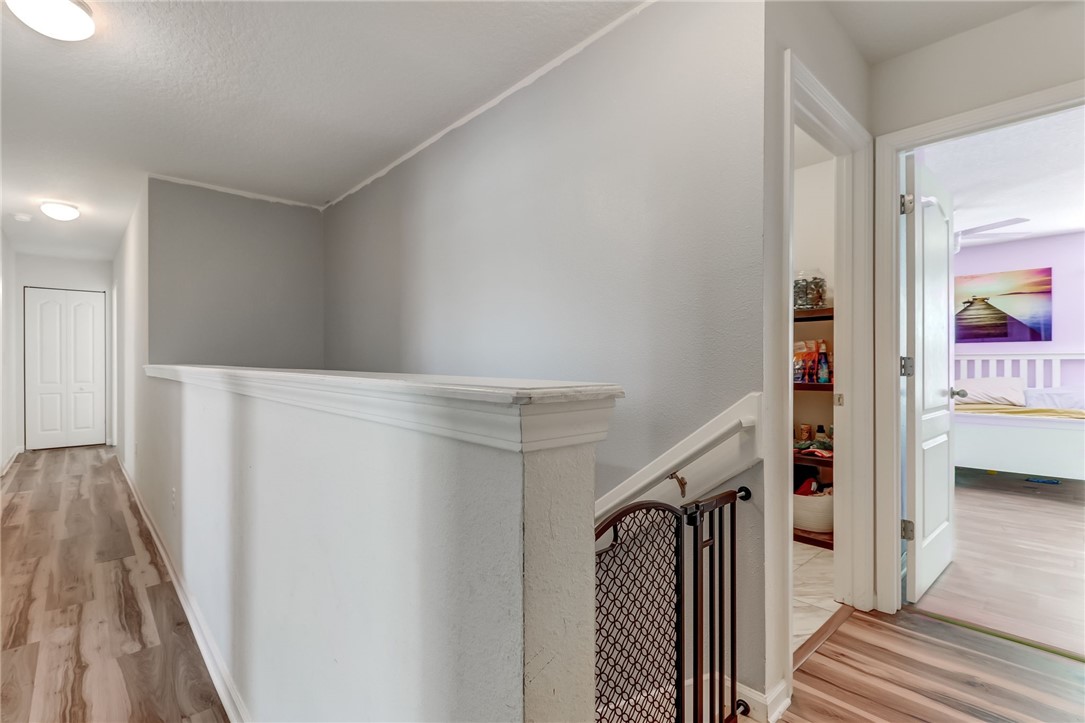 45170 Dutton Way Callahan, FL 32011 - Photo 15 of 35 a view of hallway with stairs and wooden floor