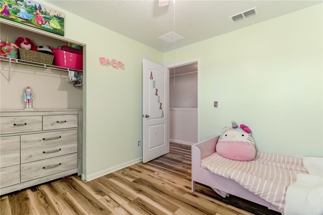 45170 Dutton Way Callahan, FL 32011 - Photo 21 of 35 a bedroom with a bed and cabinets
