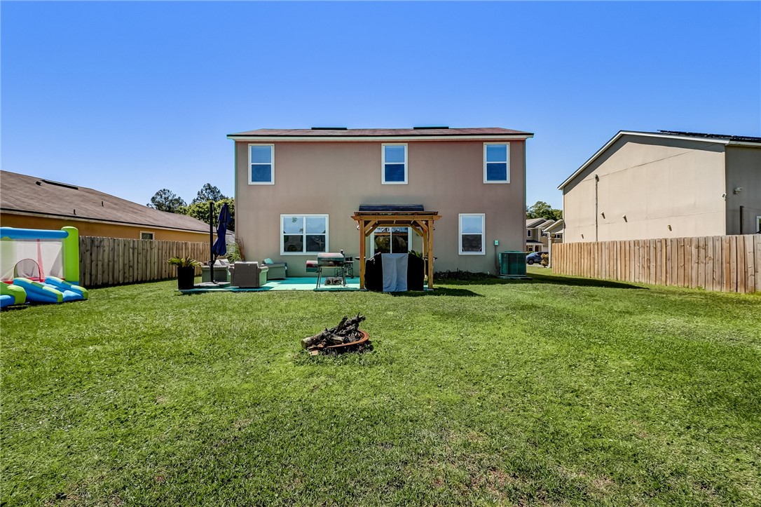 45170 Dutton Way Callahan, FL 32011 - Photo 26 of 35 a front view of a house with garden