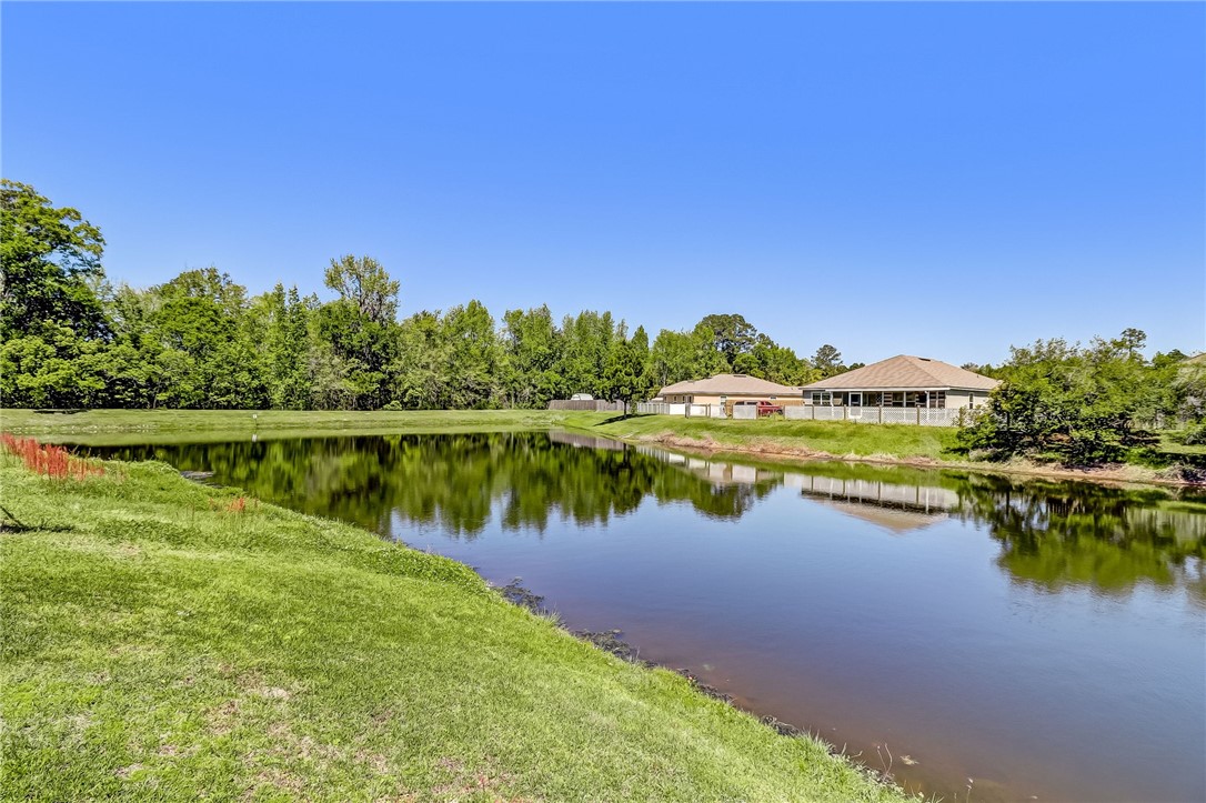 45170 Dutton Way Callahan, FL 32011 - Photo 29 of 35 a view of a lake with houses in the back
