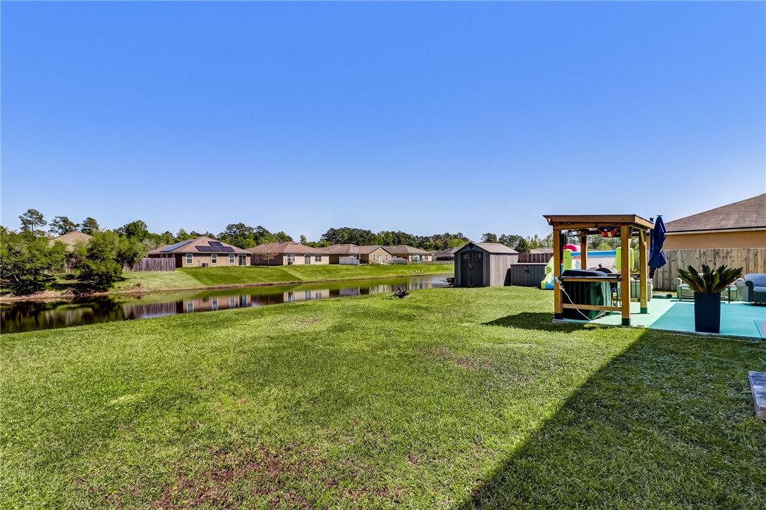 45170 Dutton Way Callahan, FL 32011 - Photo 30 of 35 a view of a house with a big yard and large trees