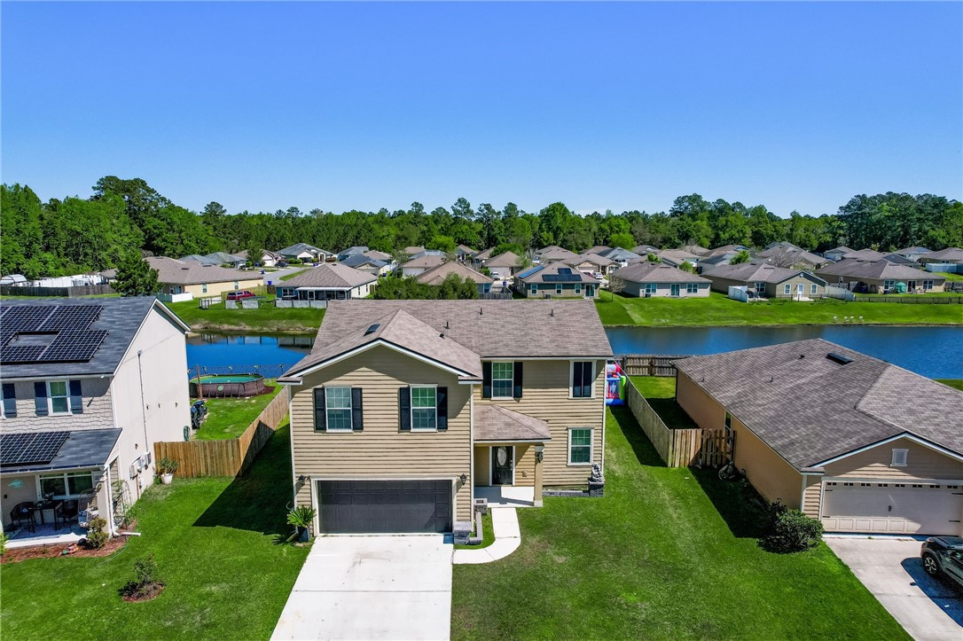 45170 Dutton Way Callahan, FL 32011 - Photo 31 of 35 a aerial view of a house with a big yard