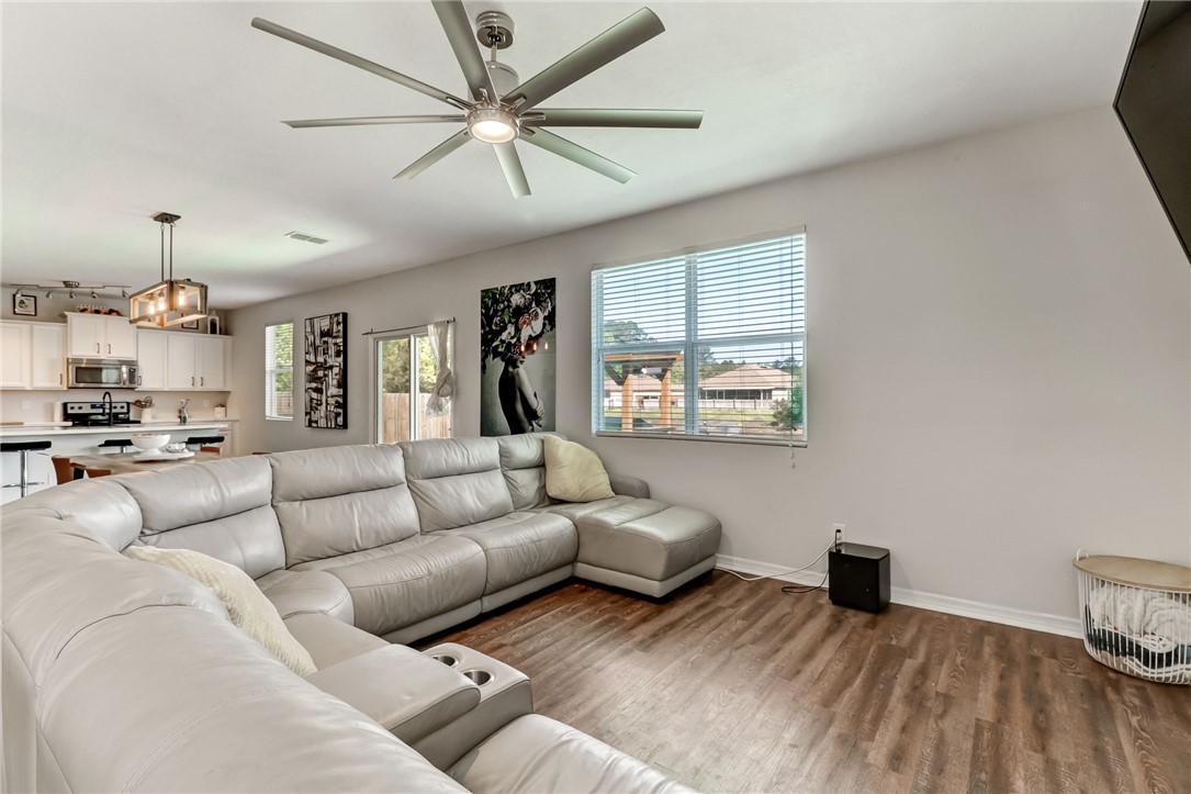 45170 Dutton Way Callahan, FL 32011 - Photo 5 of 35 a living room with furniture and a chandelier