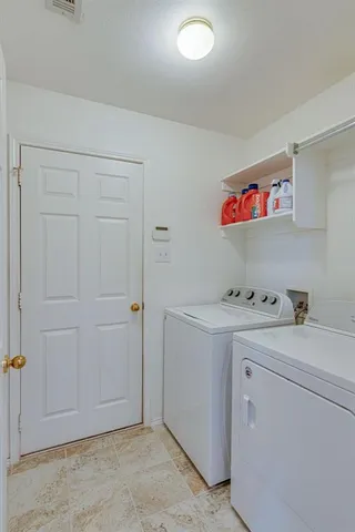 a hallway with cabinets and window